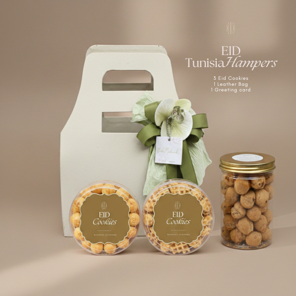Eid Tunisia Hampers with cookies, a leather bag, and a greeting card on a beige background.
