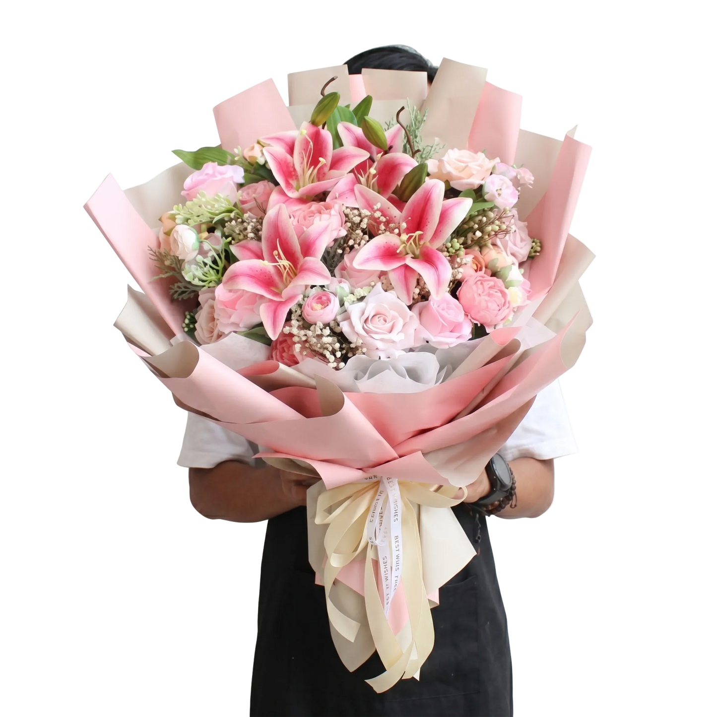 Bouquet of pink flowers with ribbons held by a person on a white background
