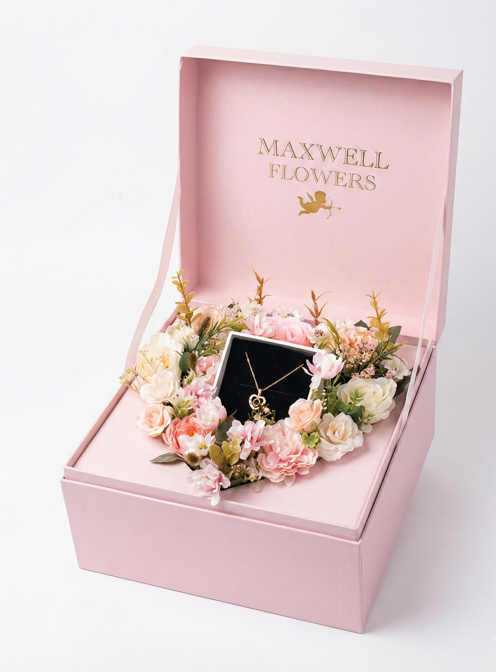 Pink gift box with flowers and a necklace, branded 'Maxwell Flowers'.
