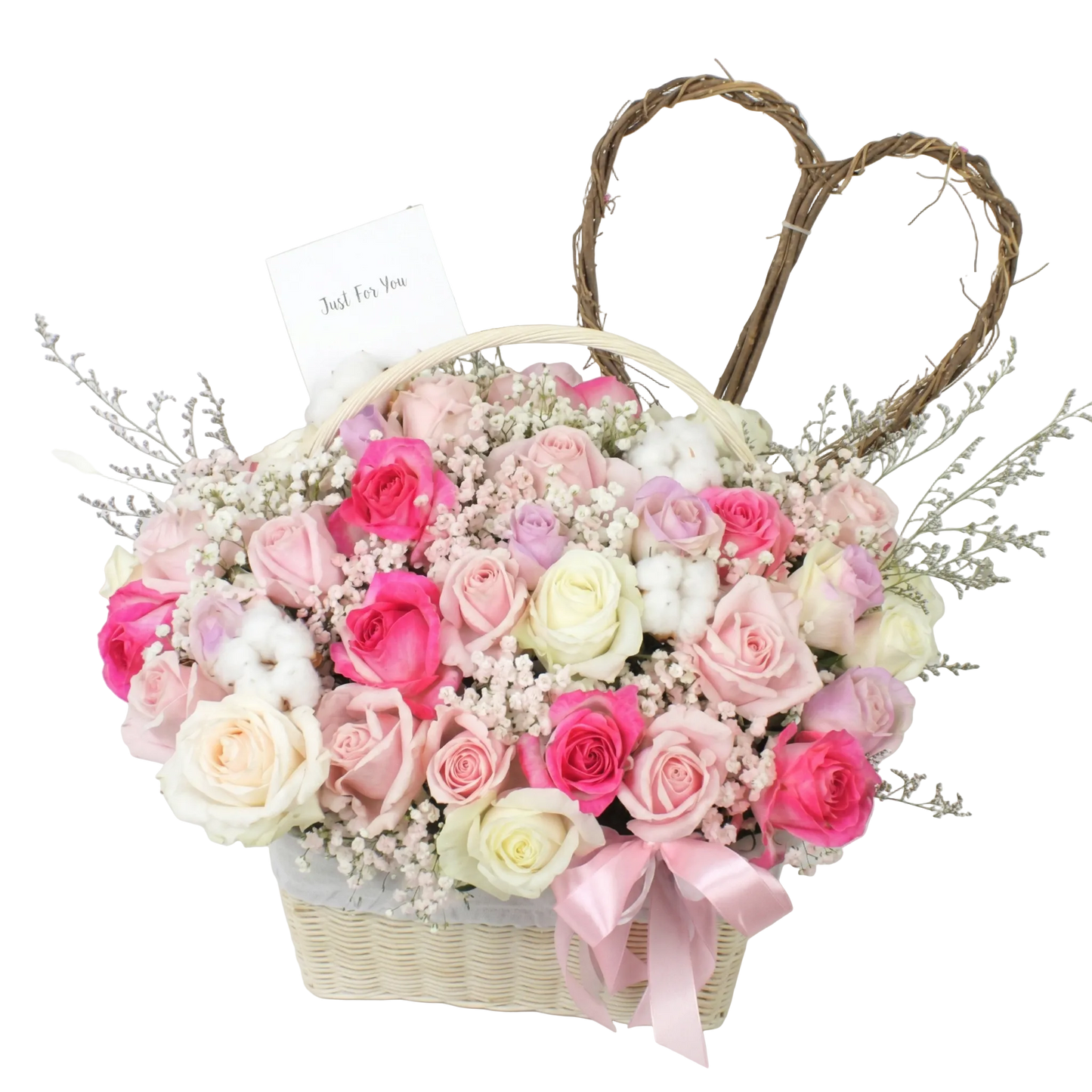 Floral arrangement in a basket with pink and white roses on a light background
