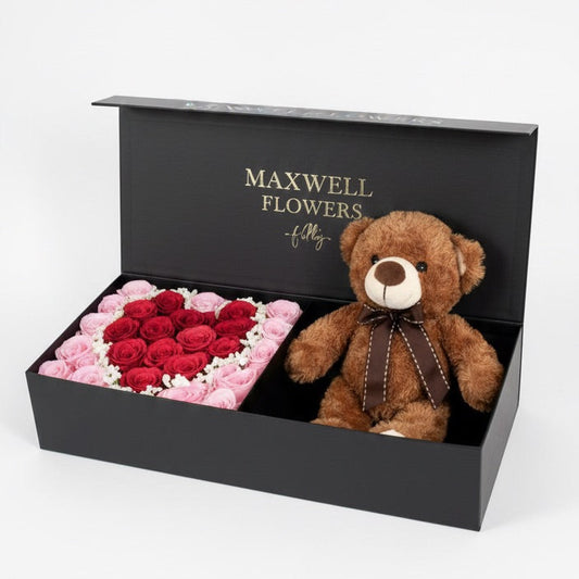 Gift set with flowers and a teddy bear in a Maxwell Flowers box.